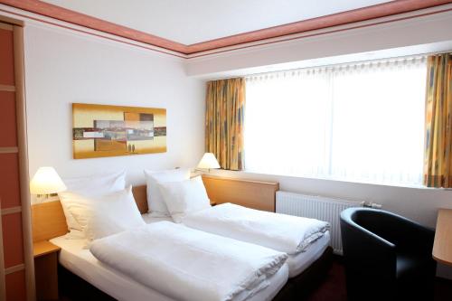 Katil atau katil-katil dalam bilik di Akzent Hotel Oberhausen