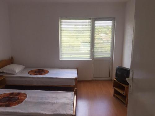 Uma cama ou camas num quarto em Guest House Shotarovi