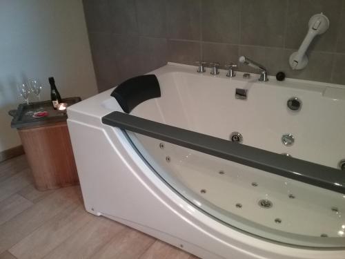 a large white bath tub in a bathroom at B&B 't Hemelbedje in Nieuwpoort