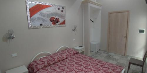 Ein Bett oder Betten in einem Zimmer der Unterkunft B&B Nonna Irene