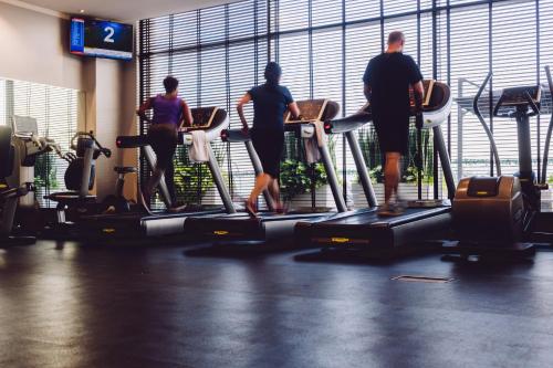 a group of people standing on treadles in a gym at Radisson Blu Hotel, Nairobi Upper Hill in Nairobi