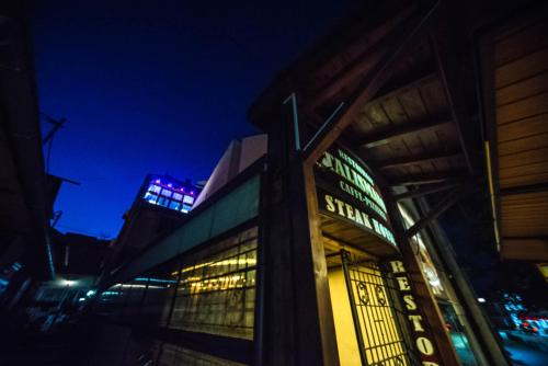 a building with stained glass windows at night at Talismano Apartments in Smederevo