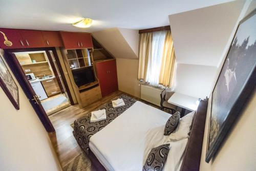 a small room with two beds in it at Talismano Apartments in Smederevo
