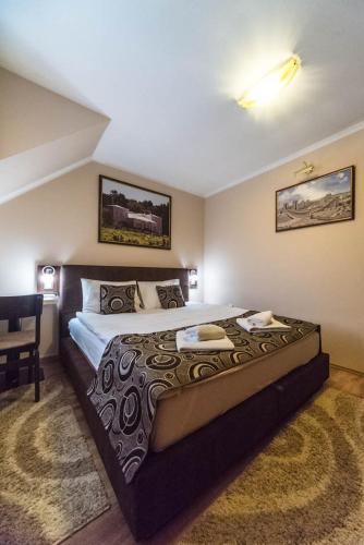 a bedroom with a large bed in a room at Talismano Apartments in Smederevo