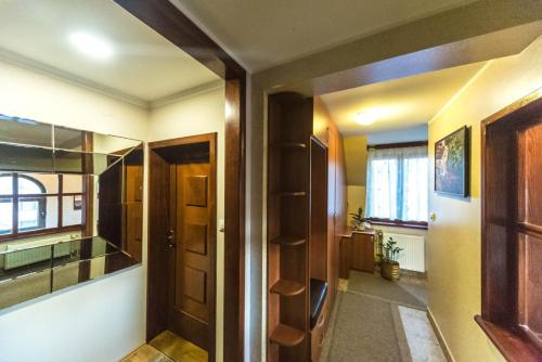 a room with a door and a hallway at Talismano Apartments in Smederevo