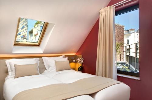 Кровать или кровати в номере Jardins de Mademoiselle Hôtel & Spa