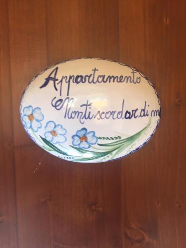 a cake on a plate with flowers on it at TRA... INCANTO E NATURA in Tramonti