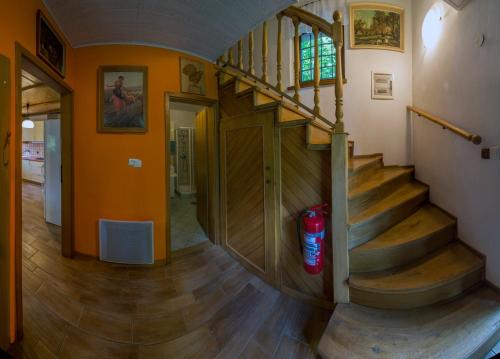 a hallway with a staircase in a house at Holiday House Vodice na Lazu in Zoll