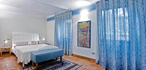 Postel nebo postele na pokoji v ubytování Carossi B&B