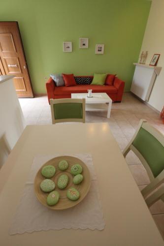 a table with a plate of cookies on top of it at Olivastro Villa in Lefkada Town