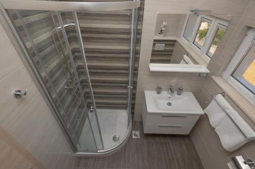 Kúpeľňa v ubytovaní APARTMANI VUJČIĆ