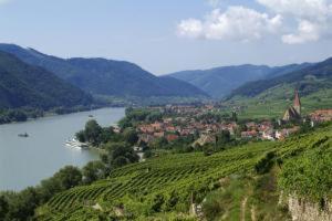 a view of a valley with a river and a town at Pension Gästehaus Heller in Weissenkirchen in der Wachau