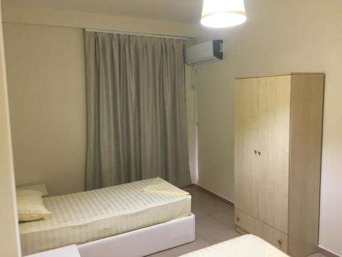 ALEXANDER Rooms & Apartmentsにあるベッド