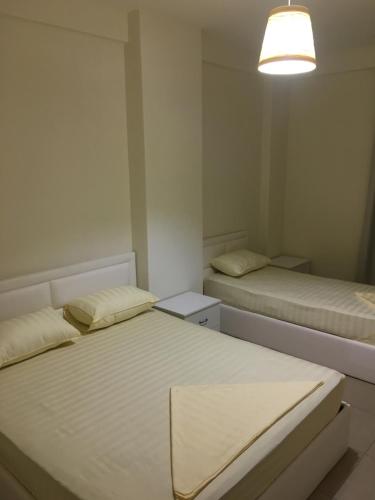 ALEXANDER Rooms & Apartmentsにあるベッド