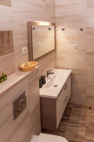 a bathroom with a sink and a mirror at Minka in Kotor