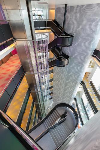 an overhead view of a spiral staircase in a building at Park Inn by Radisson Amsterdam City West in Amsterdam