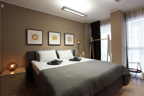 Кровать или кровати в номере City Center Apartments