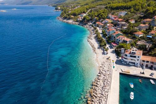 an aerial view of a beach with boats in the water at Guest House Simoni in Prigradica