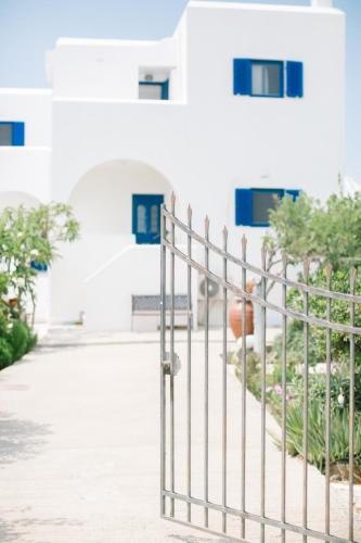 a metal fence in front of a building at Ktima Tzaneti in Lachania