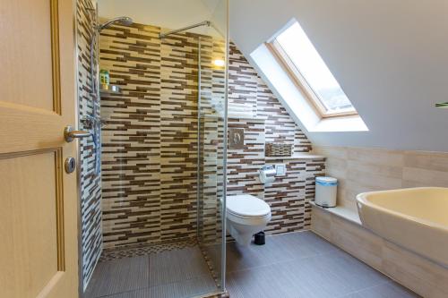 Kylpyhuone majoituspaikassa VIVAZA Villa Szigliget