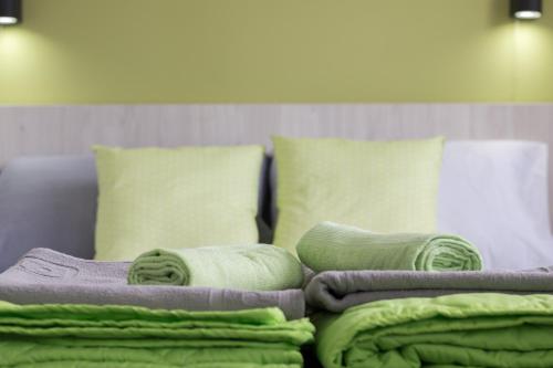 AGH Elite Apartments & Studiosにあるベッド