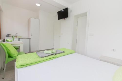 AGH Elite Apartments & Studiosにあるベッド