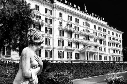 a statue of a woman in front of a building at Grand Hotel & des Anglais Spa in Sanremo