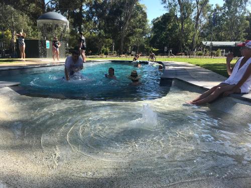 a group of people in a swimming pool at Eildon Pondage Holiday Park in Eildon