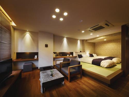 Postel nebo postele na pokoji v ubytování Hotel Oyanagi