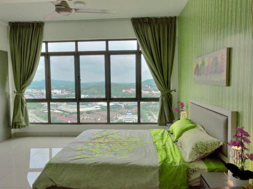 a bedroom with a bed and a large window at Comfort Zone Premium Guesthouse @ Evo Bangi in Bangi