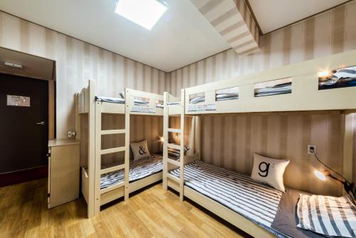 A bunk bed or bunk beds in a room at Funstay Inn Guesthouse
