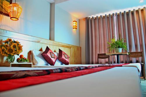 Ένα ή περισσότερα κρεβάτια σε δωμάτιο στο Sapa Aroma Hotel