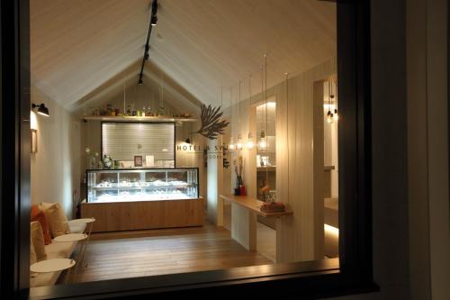 a room with a bar in the middle of a room at Hotel & Sweets Fukuoka -ADULT ONLY- in Fukuoka
