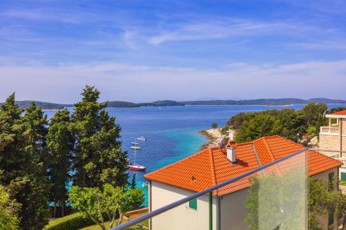 a view of a body of water from a building at Pharia Hotel and Apartments - by the beach in Hvar