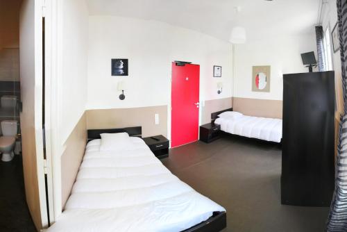Кровать или кровати в номере Hôtel de France