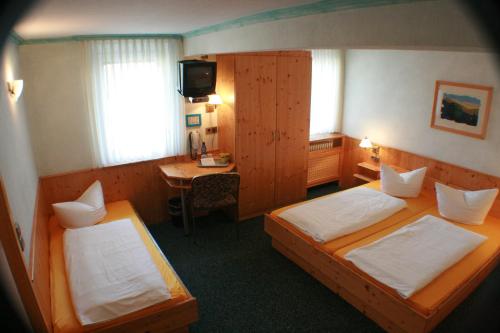 Postel nebo postele na pokoji v ubytování Hotel Rebstock