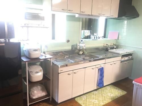 Cuisine ou kitchenette dans l'établissement Minnkayado intoparitosura