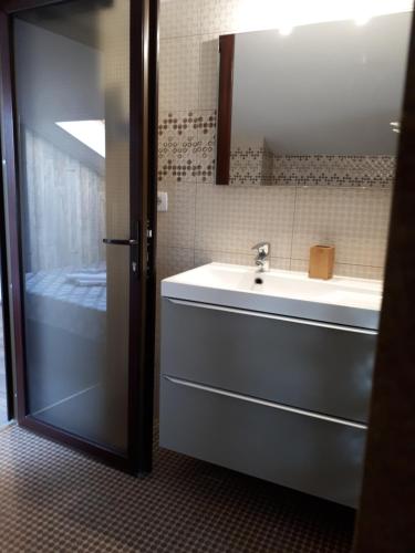 a bathroom with a sink and a mirror at Casa Mea in Eforie Nord
