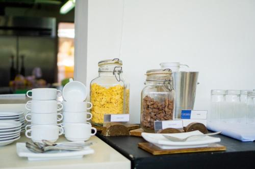 a counter with two jars of food and other ingredients at Canvas Boutique Hotel in Puerto Princesa City
