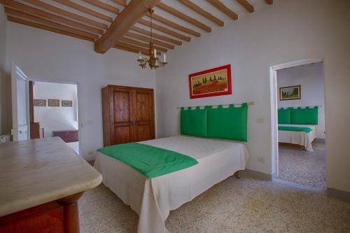 Tempat tidur dalam kamar di Ospiti del Borgo - Casa del Giusti