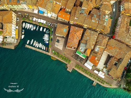 an overhead view of a harbor with a body of water at Hotel Garnì Bartabel in Gargnano