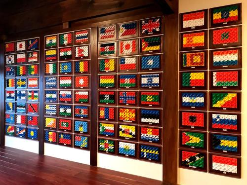 a wall of brightly colored lego duplicates at Guesthouse Wasabi in Iki