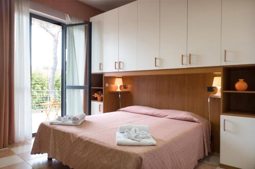 Ένα ή περισσότερα κρεβάτια σε δωμάτιο στο Hotel Maita