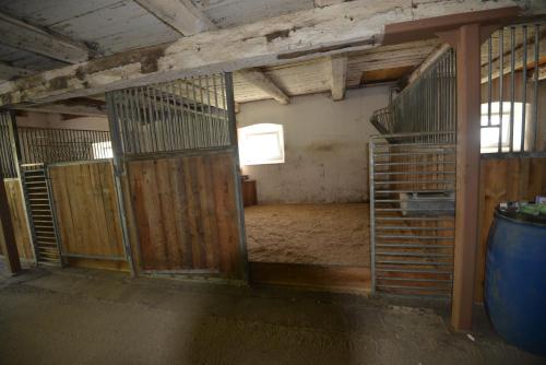 an inside view of a room with a barn with a large door at PirkerHof in Wenischgraben