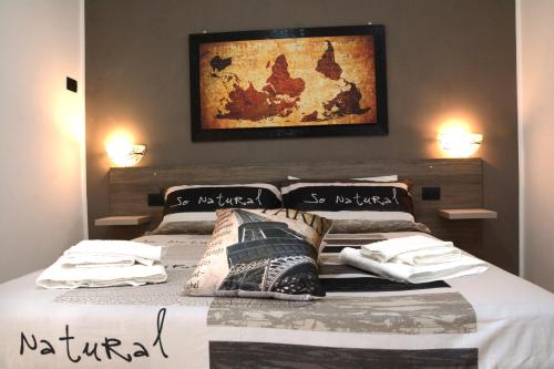 a bedroom with a bed with two pillows on it at Sylva Mala Home in Trecase