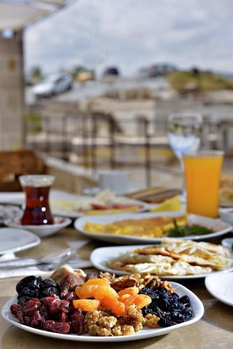 a table with plates of food on top at Seki Cave Suites in Goreme
