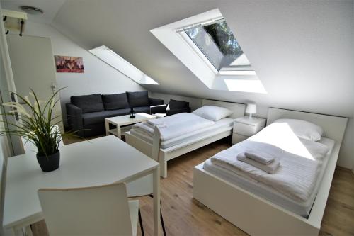 Exclusive Apartment Cologne tesisinde bir odada yatak veya yataklar