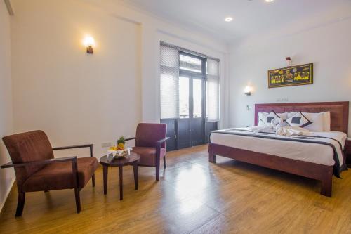 En eller flere senge i et værelse på Villa Tissa Beach Resort