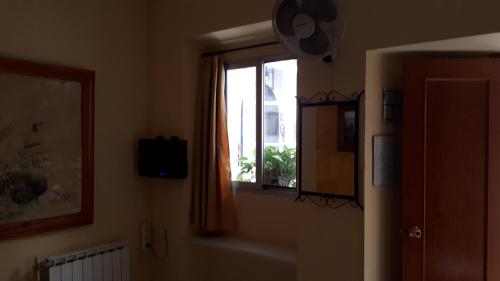a room with a window and a window sill at Hostal Manolo in El Puerto de Santa María