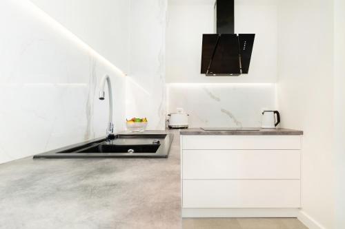 Kuchyň nebo kuchyňský kout v ubytování Apartament Klifowa z widokiem na morze i basenem